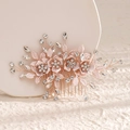 Detailed view of a rose gold floral hair comb with rhinestones and metal leaves - 1# Rose Gold Hair Comb