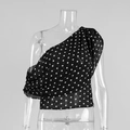 Détail d'un haut noir à pois à une épaule avec fronces latérales sur un mannequin - S / Noir