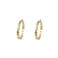 Close-up of golden C-shaped hoop earrings with intricate floral cut-out pattern details - Daisy Hollow Out / Gold