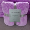 Folded purple pineapple plaid flannel blanket with decorative ribbon and gift packaging - Light Purple