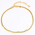 Dettaglio della collana a serpente placcata oro 18k con cinque zirconi verde smeraldo - Zirconia Blu