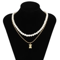Double-layer necklace with white faux pearls and gold chain featuring a bear pendant - Gold Panda/Bear