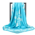 Close-up of blue paisley satin scarf with elegant white patterns on a black stand - 90*90cm / Light Blue