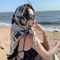 Square silk scarf with black fashion print worn as a headscarf at the beach - Heels Rose-Champagne