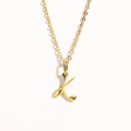 Golden stainless steel necklace featuring letter K pendant with a small heart accent - Gold - Letter K