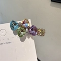 Exquisiter Kristall-Haarclip mit fünf bunten facettierten Steinen auf Metallsockel - Regenbogen