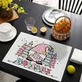 Christmas placemat with pink leopard hat gnome and trees on black wooden table - CD57-18