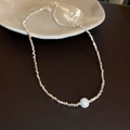 Detailed view of silver beaded necklace featuring a central white lustrous pearl pendant - Necklace-(Freshwater Pearl)