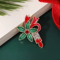Cute Christmas Santa Claus enamel brooch with red bow and green holly leaf details - Style 9