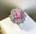 Elegant silver ring with a large pink rectangular gemstone and floral diamond halo - Adjustable Open / Pink