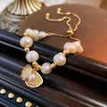 Baroque freshwater pearl bracelet with a diamond shell pendant and adjustable gold chain - Adjustable Freshwater Pearl Shell