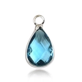 Macro view of blue teardrop birthstone pendant with faceted glass and silver-tone setting - Silver - March