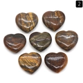 Polished natural tiger eye heart stones with shimmering golden cat eye effect - Tiger's Eye