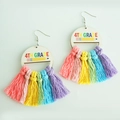Detail view of 4th Grade wooden earrings featuring colorful pencil and hand-woven tassels - 4th Grade