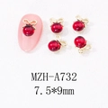Detailansicht der Nagelschmuck-Anhänger mit roter Perle und goldener Schleife 7.5x9mm - Goldene Schleife Rote Perle (A732)