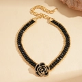 Dark gothic choker necklace featuring black beaded chain and diamond-encrusted rose pendant - Gold-tone Black Necklace