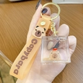 Capybara keychain with orange silicone strap and acrylic liquid floating cube - Square Capybara - Sleeping