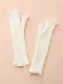 White knitted arm sleeves with distressed hole design and frayed fringe details - White