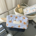 Quilted blue cosmetic bag with cute bear pattern and woven handle for travel storage - Wristlet / Blueberry Bear