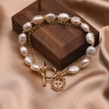 Double-layered 18k gold plated bracelet with natural pearls and a cross pendant - Double Layer Freshwater Pearl Bracelet with OT Buckle