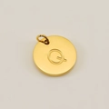 Polished golden stainless steel round charm featuring the engraved capital letter Q - Letter Q (XRS-1456) / Gold