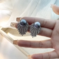 Elegant grey pearl stud earrings with fan-shaped zircon setting held by hand - E5725-2/gray