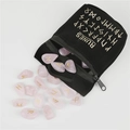 Pink crystal rune stones set with gold symbols in a black RUNES velvet drawstring bag - Rose Quartz