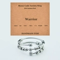 Detailed macro view of 316L stainless steel Morse code fidget ring with movable beads - WARRIOR