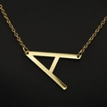 Elegant gold-tone initial necklace featuring a minimalist letter A pendant on a fine chain - Gold A