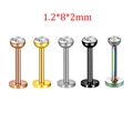 Detail of 1.2mm labret studs in five colors with clear cubic zirconia stone settings - White Zircon Style