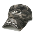 Detail of distressed camouflage baseball cap with embroidered lettering and worn brim - M (56-58cm) / Camouflage