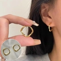 Double-layered crossed geometric square earrings in golden finish shown on model - Gold Twisted Square Earrings (ED2412-2)