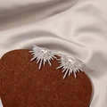 Elegant silver sunburst stud earrings with zircon inlay on luxury fabric background - Silver Sunflower Zirconia Studs