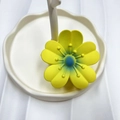 Matte yellow flower hair claw with blue gradient center on a white tray - Bright Yellow (Rubber Paint Lucky Flower)