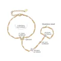 Detail view of gold stainless steel slave bracelet with zircon butterfly and freshwater pearl - E681-Butterfly/Pearl / Gold