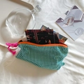 Detail of green and white checkered canvas pouch with orange zipper and pink rope handle - Green Checkered Storage Bag