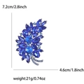 Elegant leaf-shaped brooch with blue crystals and silver frame showing 7.2cm dimensions - Blue