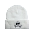 White knitted beanie with black skull and skeletal hands embroidery in a street style - One Size / White