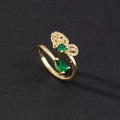 Detailed close-up of open butterfly ring featuring green and white zircon stones - Petal Butterfly Green Gem Style
