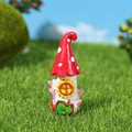 Miniature resin mushroom house ornament with a red roof and sunflower window design - Red Mushroom House (No. 2)