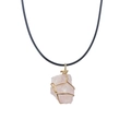 Close-up of pink crystal pendant wrapped in gold wire on a black cord necklace - Rose Quartz