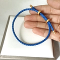 Blue braided leather cord bracelet with adjustable gold slider clasp and metal ends - Blue