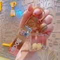 Capybara mini cube keychain with a BOOM! braided strap and small brown bell charm - Liquid Sand Capybara-Apple