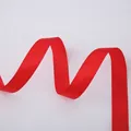 Detailed view of red satin ribbon with smooth texture for Christmas gift wrapping - Solid Christmas Red Ribbon (2.5cm Width 5m Length)