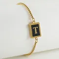 18K gold plated stainless steel bracelet featuring a black enamel letter T pendant - Letter T (ZH497G-T-02)