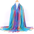 Detail shot of boho jacquard scarf showing colorful floral patterns and fringe edges - Rose Peacock Blue
