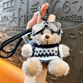 Cool plush bear keychain featuring clear goggles and a navy blue knitted sweater - Bear - Brown B&W Sweater