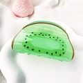 Cute green kiwi fruit hair claw clip made of translucent resin with seed patterns - Kiwi