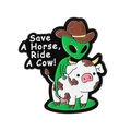 Funny green alien wearing a cowboy hat riding a cow enamel pin with humorous slogan - Save A Horse, Ride A Cow! Alien Riding Cow