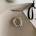 Detail of silver beaded ring with dark gray pearl on a minimalist beige ceramic plate - Silver Square Bead Ring With Dark Grey Bead (J4065)